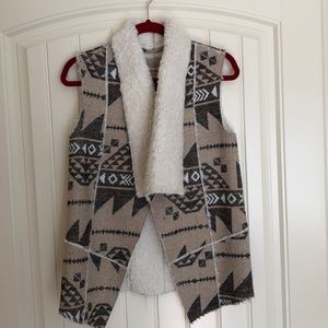 Mossino faux fur lined vest.